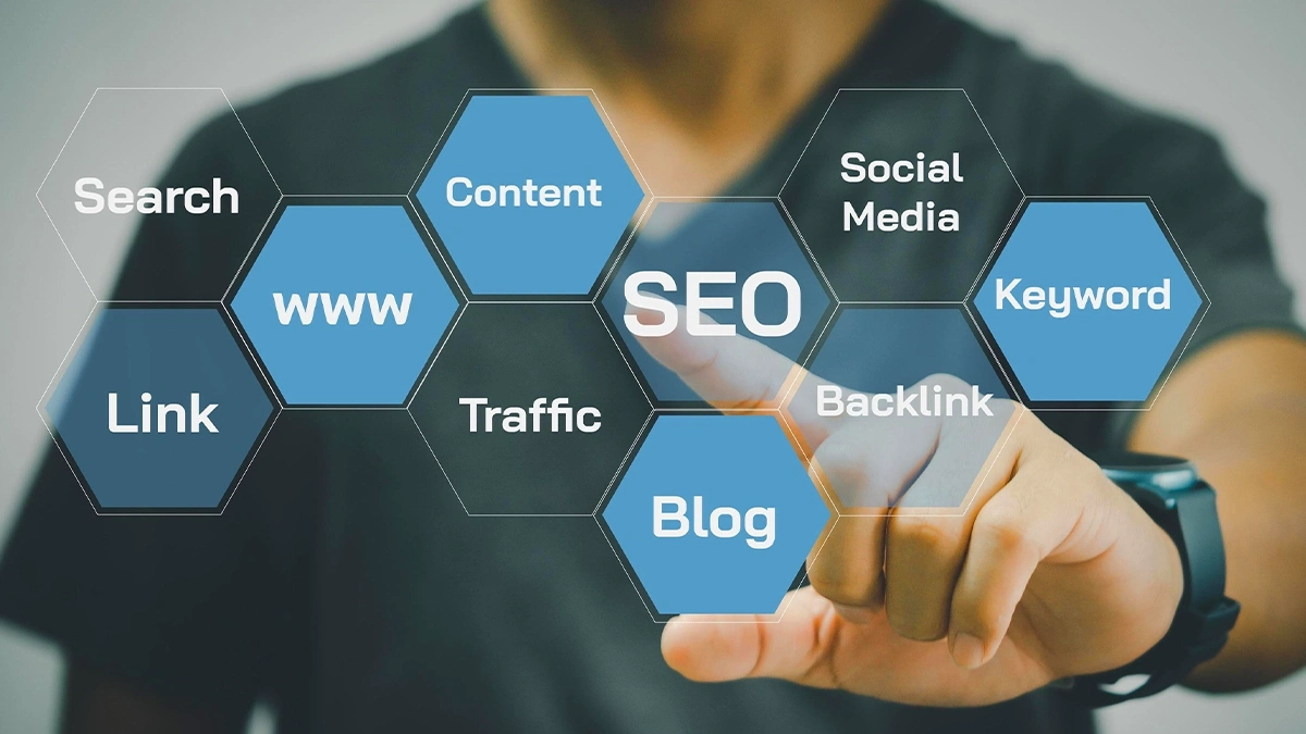 Person selecting hexagon tiles labelled content, keyword, backlink, traffic, blog and social media