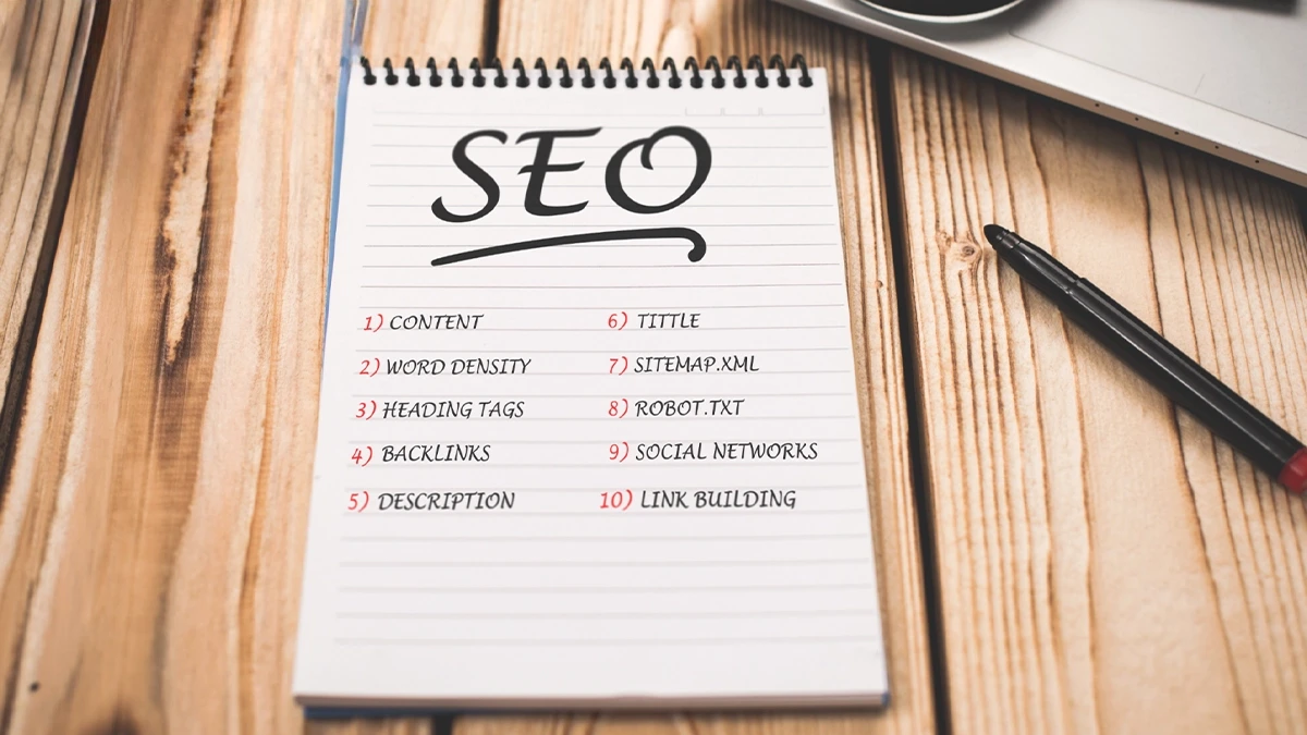 Notepad listing content, heading tags, description, sitemap and link building as ranking elements